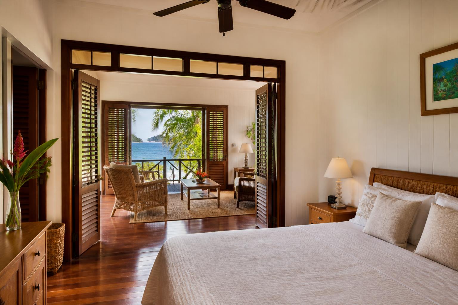 One-bedroom apartment with living area opening onto a sea-view veranda
